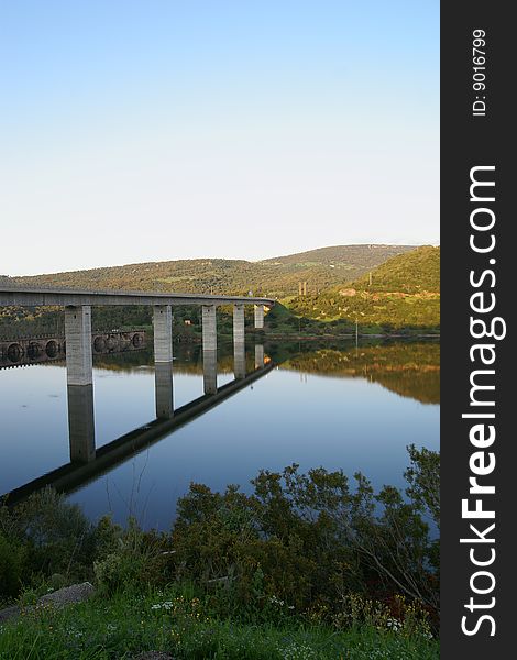 A Bridge reflected into a lake - Sardinia, Italy. A Bridge reflected into a lake - Sardinia, Italy