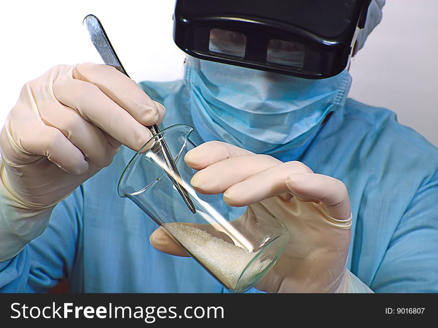 Woman laboratory assistant whit chemical glasses