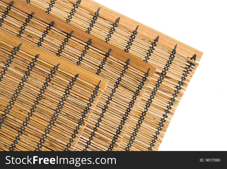 Three bamboo mats corners on white background horizontal. Three bamboo mats corners on white background horizontal
