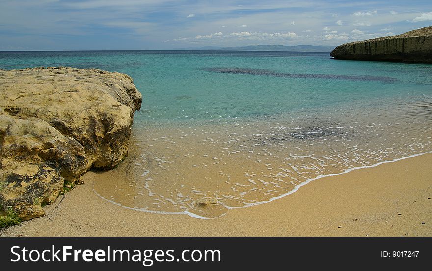 A shoot of rock and beach in the sea of Portotorres - Sardinia. A shoot of rock and beach in the sea of Portotorres - Sardinia