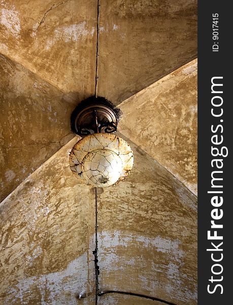 Old chandelier in a vaulted ceiling