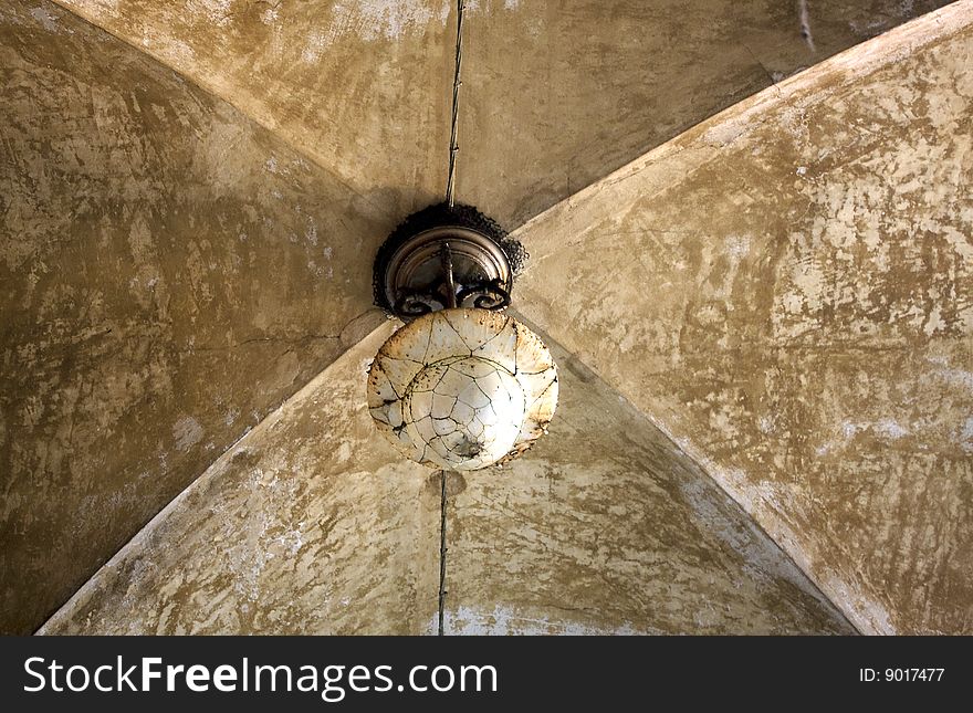 Old chandelier in a vaulted ceiling