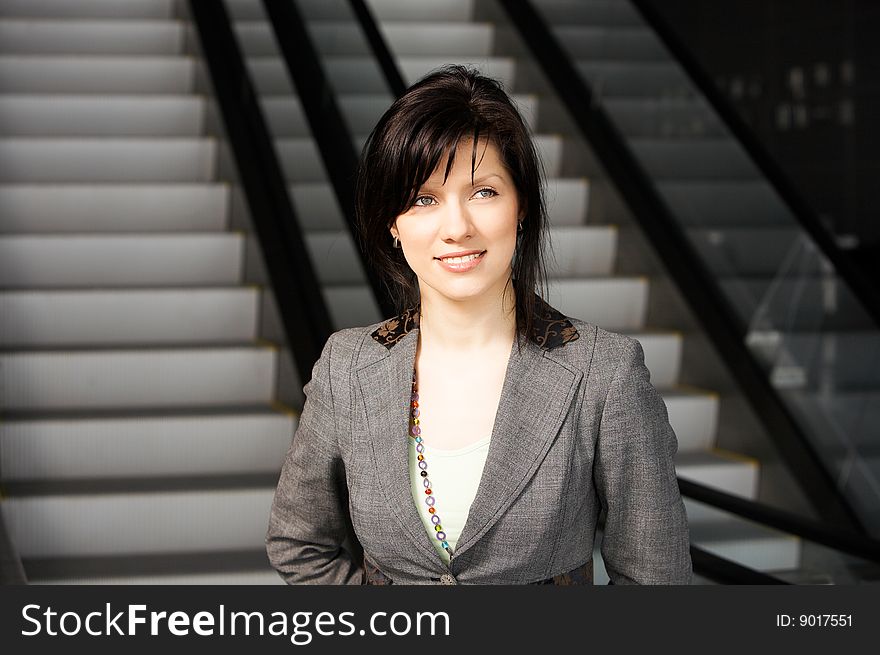 Young confident caucasian businesswoman in the working space. Young confident caucasian businesswoman in the working space