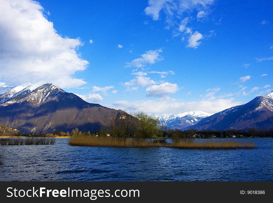 The lake by boat and snow-capped mountains