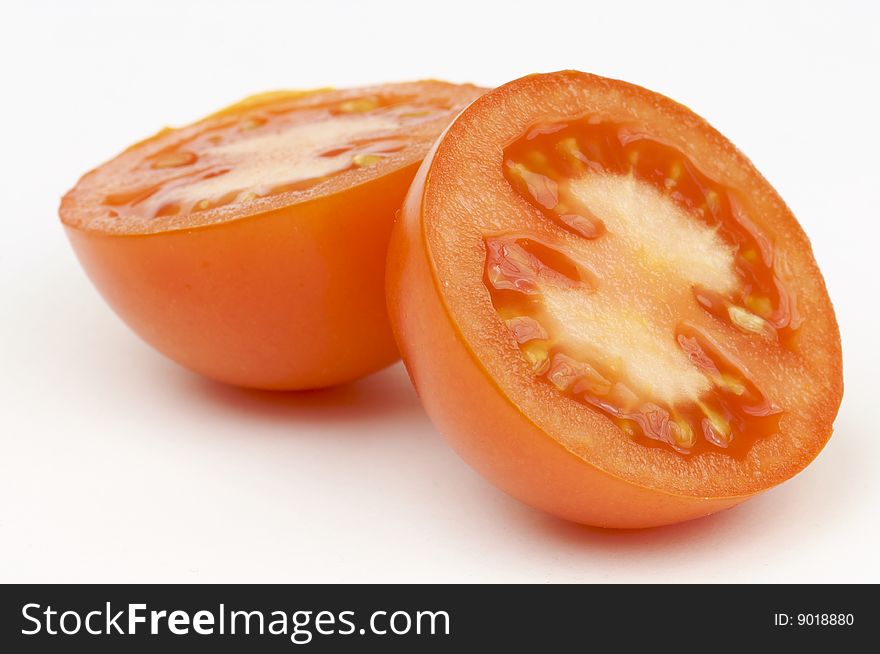 Two tomatoes with white background