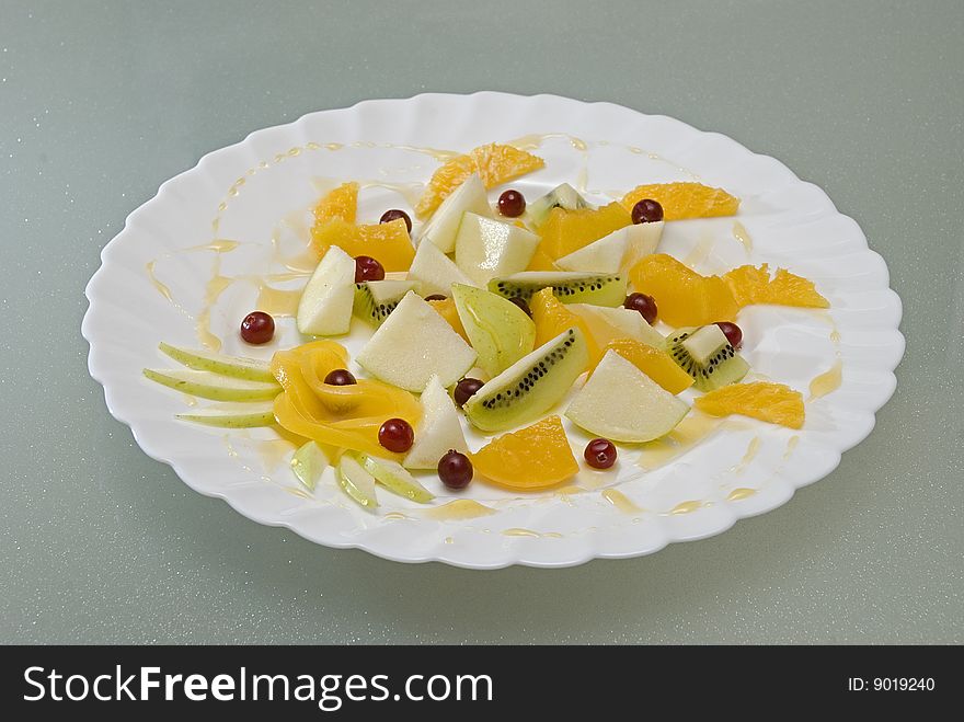 Salad from fruit and berries with honey