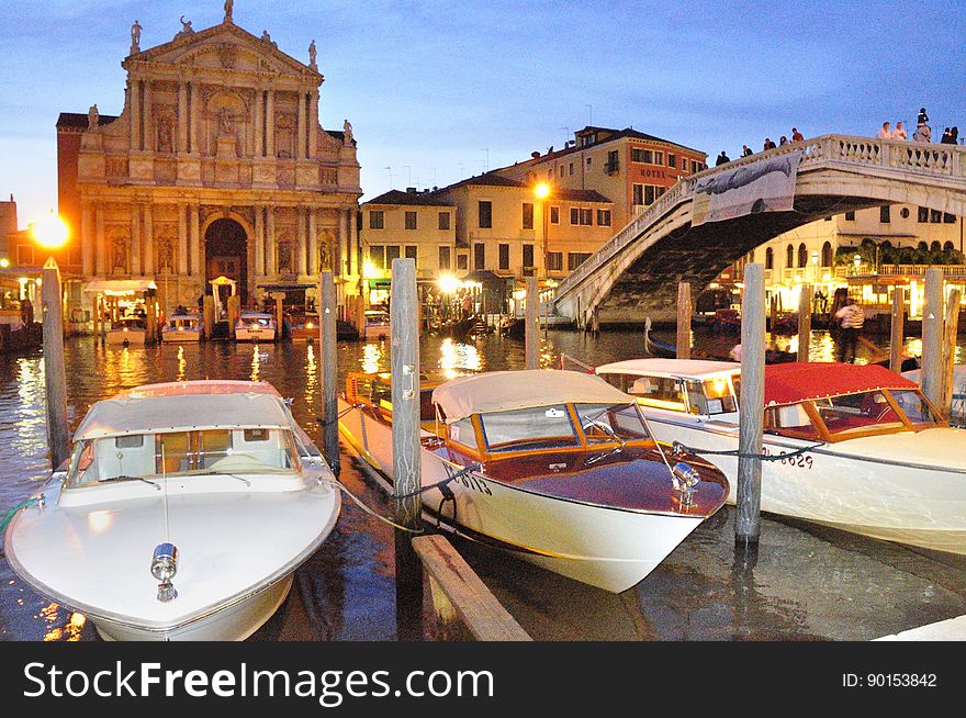 The water streets of Venice are canals which are navigated by gondolas and other small boats. During daylight hours the canals, bridges, and streets of Venice are full of tourists eager to experience the romance of this great travel destination. As night engulfs the town, tourists enjoy some fine dining at one of the many restaurants, leaving the waterways and streets quiet. The gondola is a traditional, flat-bottomed Venetian rowing boat, well suited to the conditions of the Venetian Lagoon. For centuries gondolas were once the chief means of transportation and most common watercraft within Venice. In modern times the iconic boats still have a role in public transport in the city, serving as ferries over the Grand Canal. They are also used in special regattas &#x28;rowing races&#x29; held amongst gondoliers. Their main role, however, is to carry tourists on rides throughout the canals. Gondolas are hand made using 8 different types of wood &#x28;fir, oak, cherry, walnut, elm, mahogany, larch and lime&#x29; and are composed of 280 pieces. The oars are made of beech wood. The left side of the gondola is longer than the right side. This asymmetry causes the gondola to resist the tendency to turn toward the left at the forward stroke. Venetian masks are a centuries-old tradition of Venice. The masks are typically worn during the Carnival of Venice, but have been used on many other occasions in the past, usually as a device for hiding the wearer&#x27;s identity and social status. The mask would permit the wearer to act more freely in cases where he or she wanted to interact with other members of the society outside the bounds of identity and everyday convention. It was thus useful for a variety of purposes, some of them illicit or criminal, others just personal, such as romantic encounters. The water streets of Venice are canals which are navigated by gondolas and other small boats. During daylight hours the canals, bridges, and streets of Venice are full of tourists eager to experience the romance of this great travel destination. As night engulfs the town, tourists enjoy some fine dining at one of the many restaurants, leaving the waterways and streets quiet. The gondola is a traditional, flat-bottomed Venetian rowing boat, well suited to the conditions of the Venetian Lagoon. For centuries gondolas were once the chief means of transportation and most common watercraft within Venice. In modern times the iconic boats still have a role in public transport in the city, serving as ferries over the Grand Canal. They are also used in special regattas &#x28;rowing races&#x29; held amongst gondoliers. Their main role, however, is to carry tourists on rides throughout the canals. Gondolas are hand made using 8 different types of wood &#x28;fir, oak, cherry, walnut, elm, mahogany, larch and lime&#x29; and are composed of 280 pieces. The oars are made of beech wood. The left side of the gondola is longer than the right side. This asymmetry causes the gondola to resist the tendency to turn toward the left at the forward stroke. Venetian masks are a centuries-old tradition of Venice. The masks are typically worn during the Carnival of Venice, but have been used on many other occasions in the past, usually as a device for hiding the wearer&#x27;s identity and social status. The mask would permit the wearer to act more freely in cases where he or she wanted to interact with other members of the society outside the bounds of identity and everyday convention. It was thus useful for a variety of purposes, some of them illicit or criminal, others just personal, such as romantic encounters.