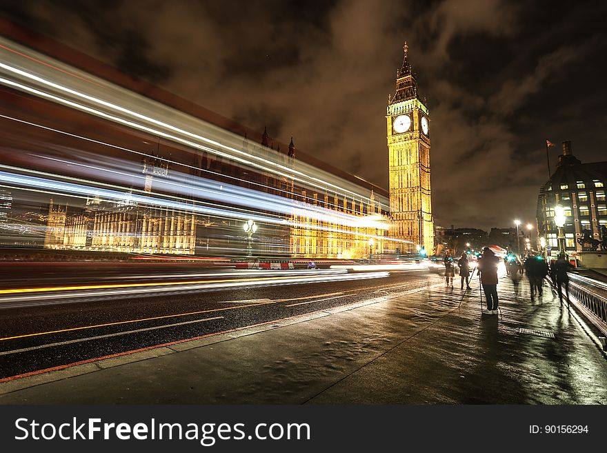 The Palace of Westminster in a long exposure with light trails from passing cars in London, England.