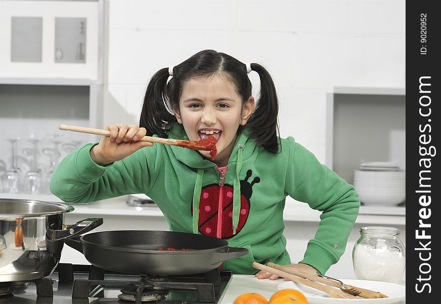 Little girl in the kitchen