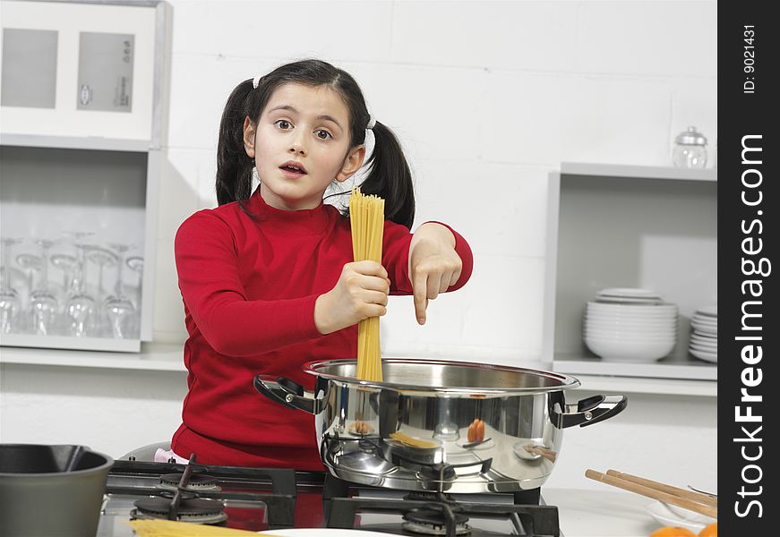 Little girl in the kitchen