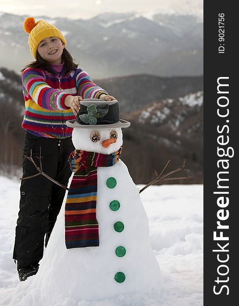 Girl Posing With Her Snowman