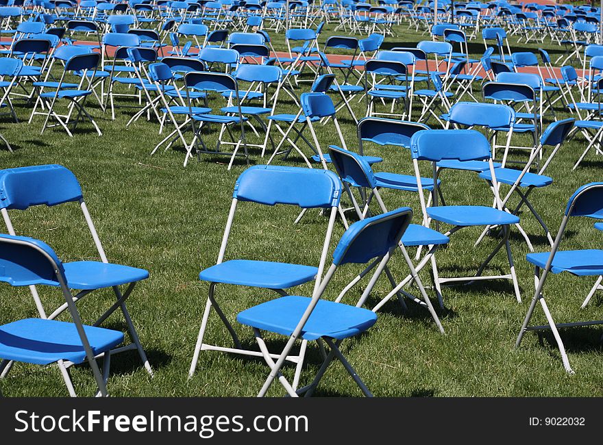 Groups of blue chairs that are empty are a metaphor for such things as opportunities, placement, and emptiness. Groups of blue chairs that are empty are a metaphor for such things as opportunities, placement, and emptiness.