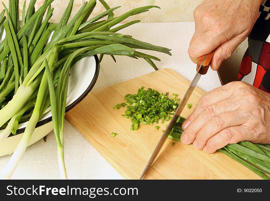 Cutting of a green onions, process of preparation. Cutting of a green onions, process of preparation