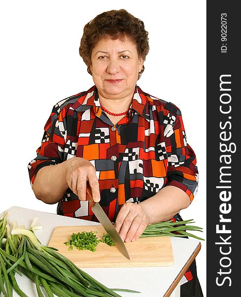 Woman cuts vegetables