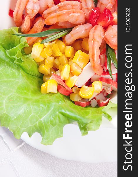 Tasty green salad with prawns and corn