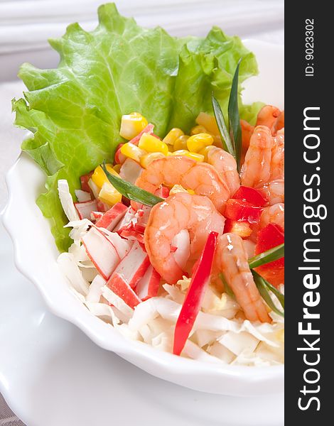 Delicious salad with prawns and corn close up