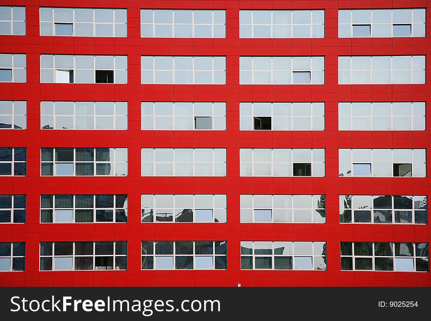 Background of multi glass windows on red building