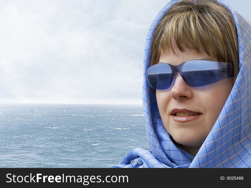 Portrait of a young woman looking out over the sea