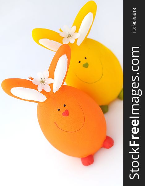Two easter's candle rabbit ,orange and yellow