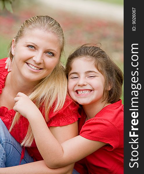 Mother Daughter in Red with Big Smiles