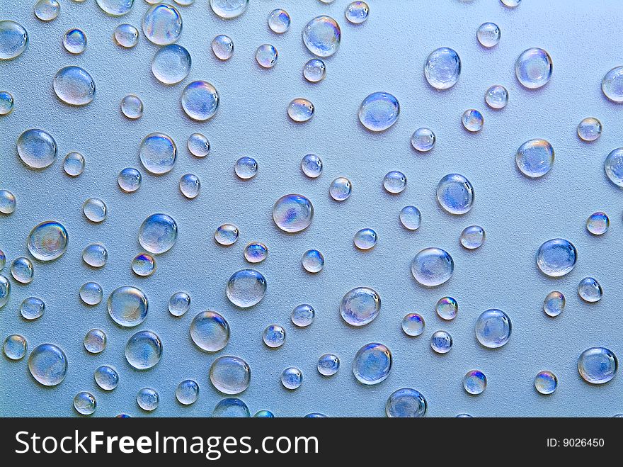 Beautiful background from droplets on a dark blue background