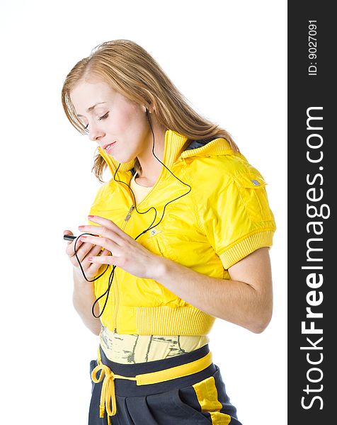 A sporty young girl listening to music