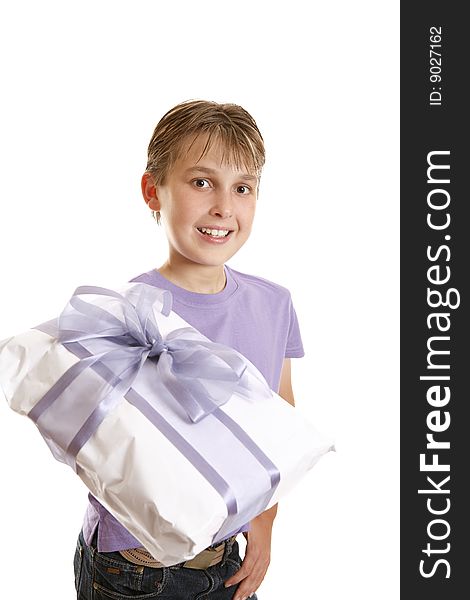 A boy holds a wrapped present tied up with gauze and satin purple ribbon. A boy holds a wrapped present tied up with gauze and satin purple ribbon.