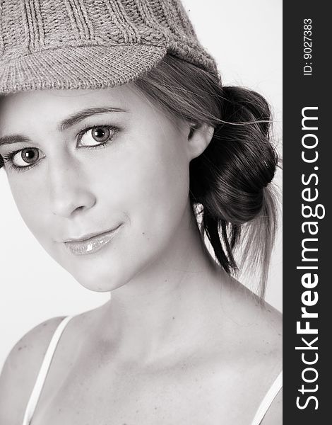 Beautiful young female model wearing a grey hat. Beautiful young female model wearing a grey hat