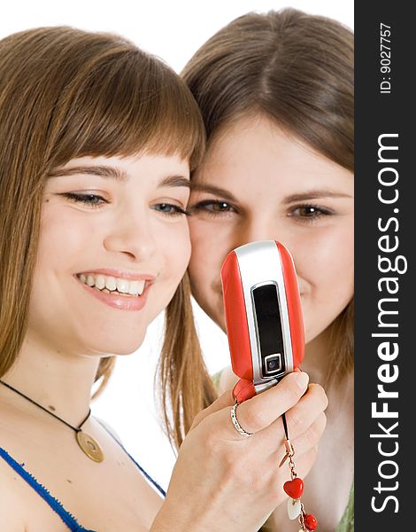 Two pretty girls reading SMS on mobile phone