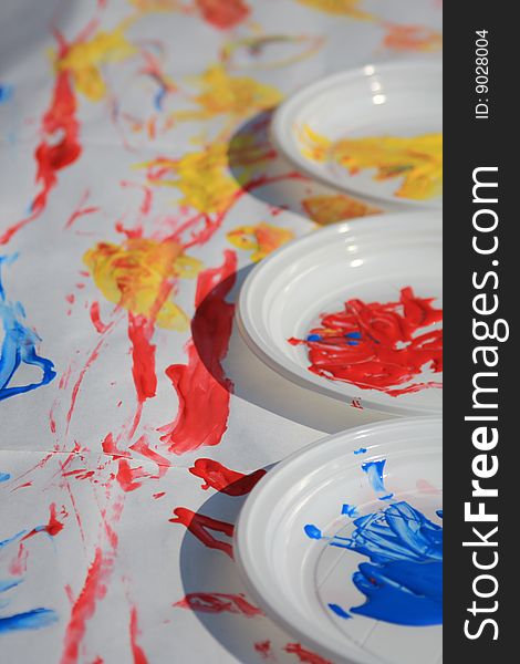 White dishes with colorful tempera. White dishes with colorful tempera