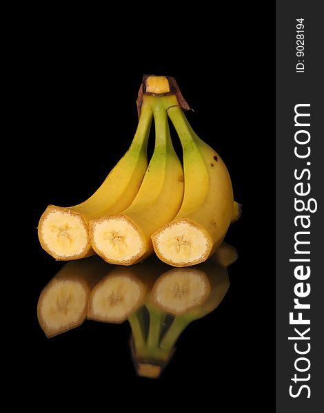 Still life mature cut bananas on black background with clipping path