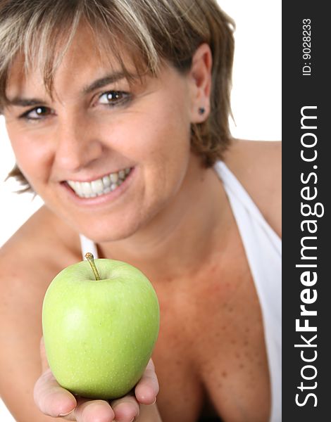 Beautiful mature female holding fruit. FOCUS ON APPLE. Beautiful mature female holding fruit. FOCUS ON APPLE