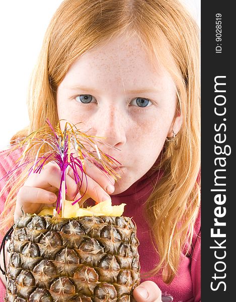 Red head girl is drinking from a fresh pineapple isolated on white. Red head girl is drinking from a fresh pineapple isolated on white