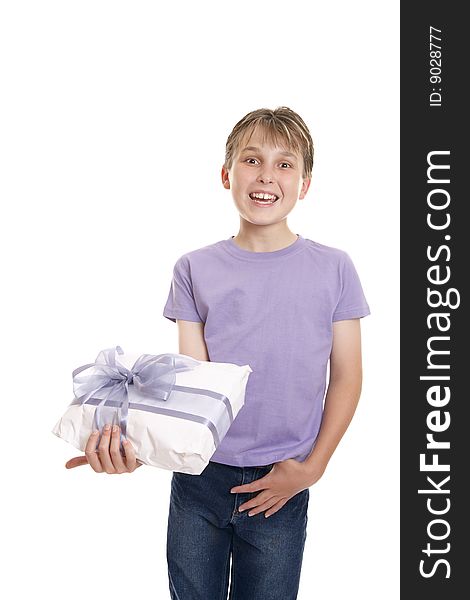 Excited  boy in plain t-shirt and jeans holding a wrapped present ready for birthday or other special occasion. Excited  boy in plain t-shirt and jeans holding a wrapped present ready for birthday or other special occasion.