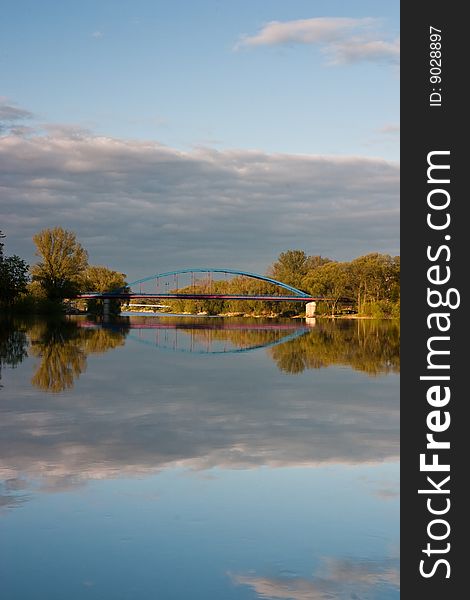 Bridge and Reflection On The River