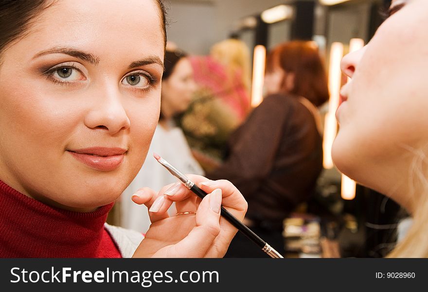 Young woman in the beauty salon,make up in progress