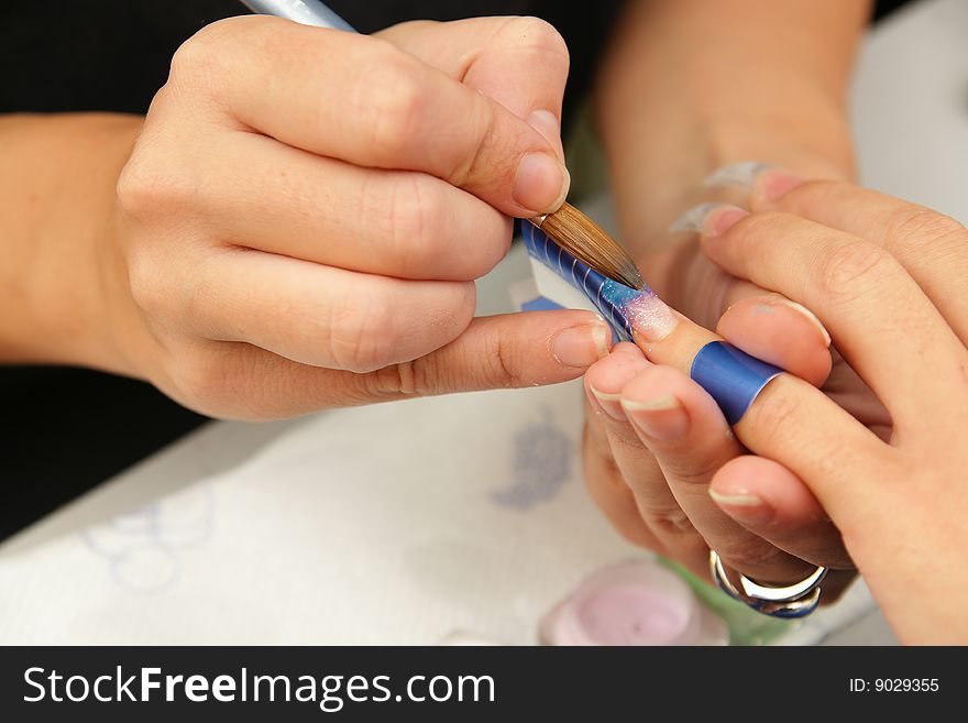 Manicure procedure in beauty center. Manicure procedure in beauty center