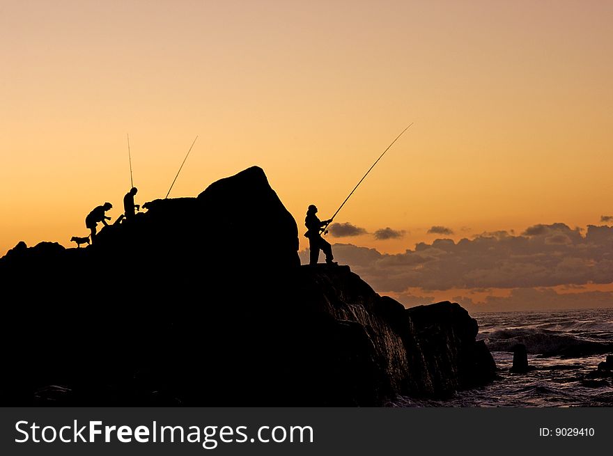 A Silhouette Of Fishermen