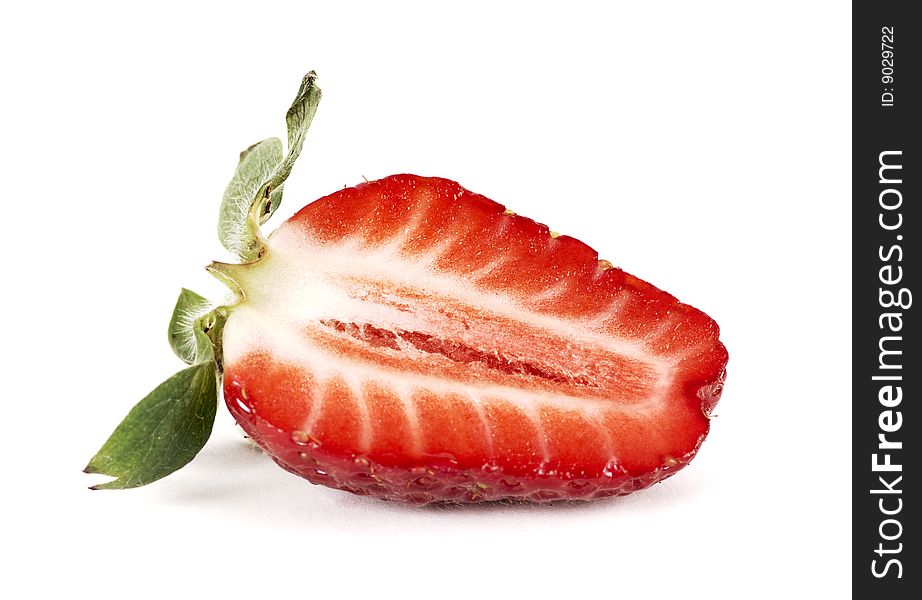 Strawberry cut in half on a white