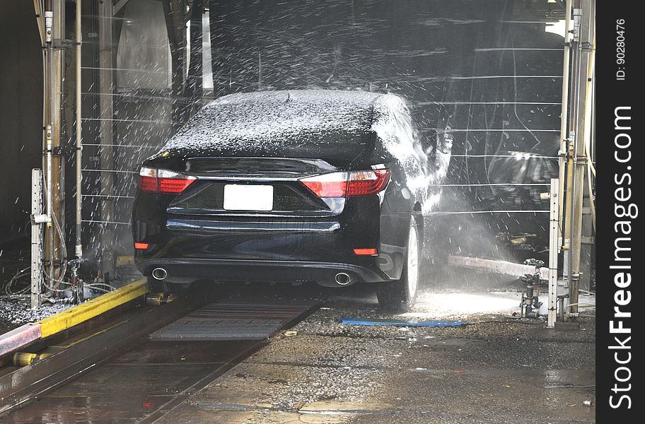 A car in an automatic car wash. A car in an automatic car wash.