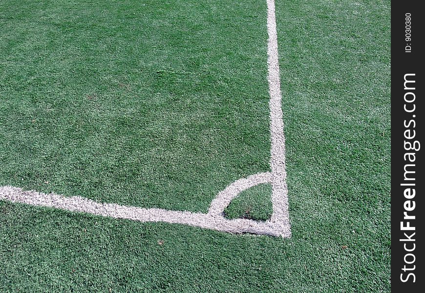 Corner on football/soccer pitch with green artificial grass. Corner on football/soccer pitch with green artificial grass