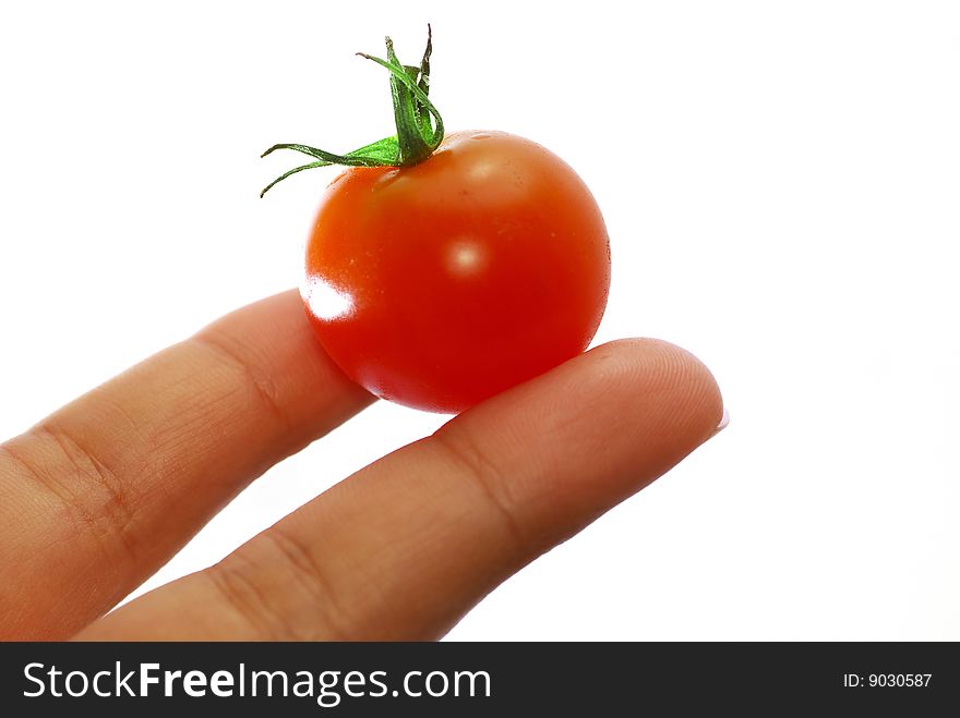 Close up capture fresh red tomato on hand. Close up capture fresh red tomato on hand