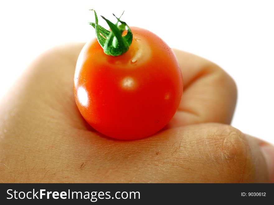 Close up capture fresh red tomato on hand