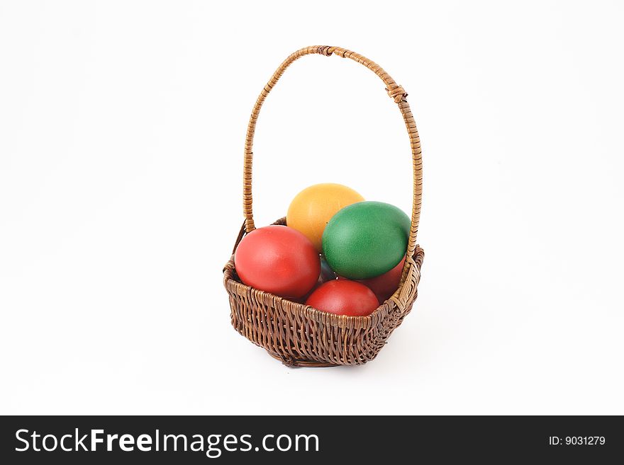 Basket with Easter egg on white