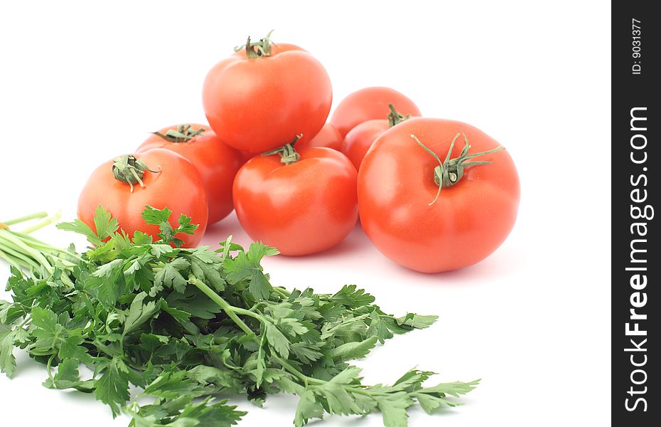 Tomatoes with parsley on the white background