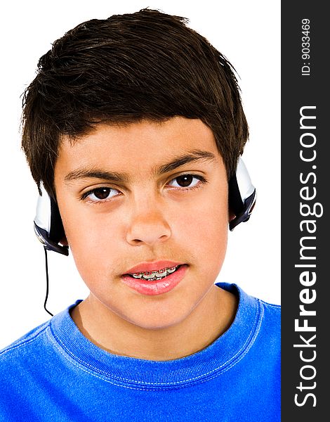 Portrait of a boy listening to music isolated over white. Portrait of a boy listening to music isolated over white