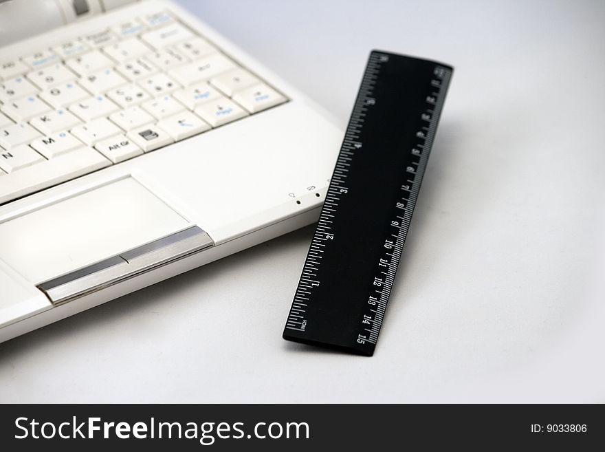 Netbook, ultra portable notebook with ruler for comparison