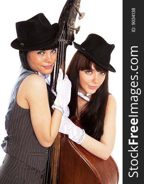 Two young beautiful brunettes with old contrabass