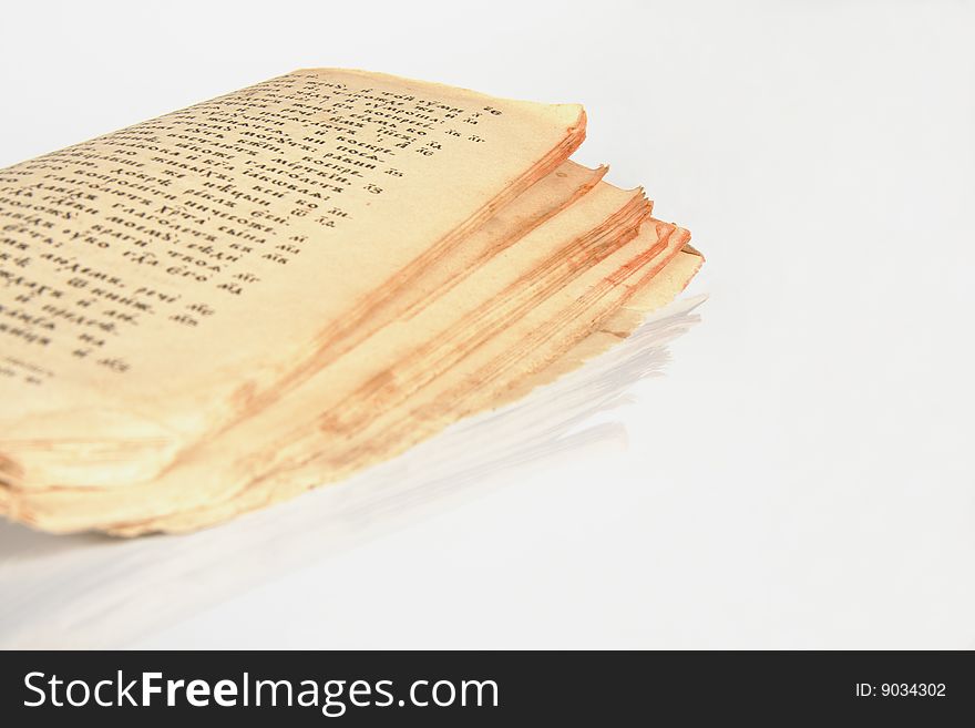 Open antique book with yellowed grunge pages on white background. Open antique book with yellowed grunge pages on white background