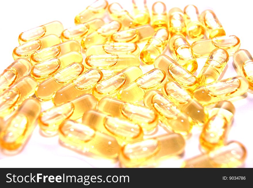 Macro of  bunch of yellow gel pills